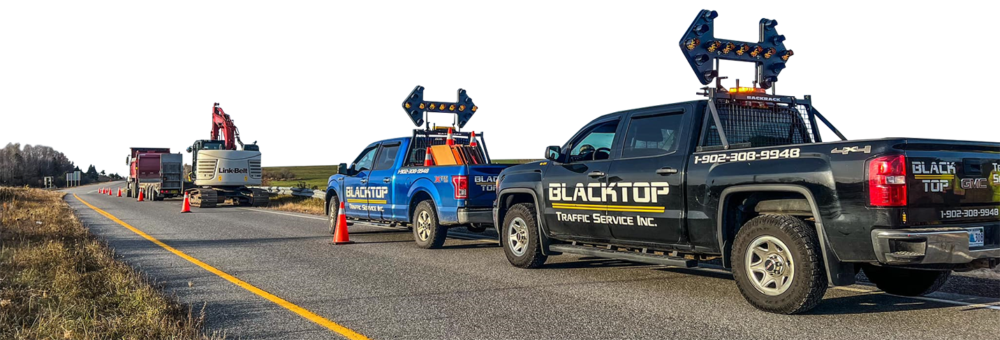 Blacktop Traffic Service trucks and equipment on a Nova Scotia highway job site