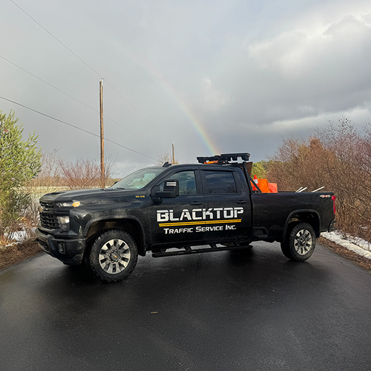 Blacktop Traffic Service truck with rainbow