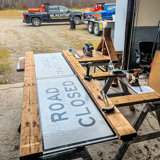 Road closed sign being built in the shop